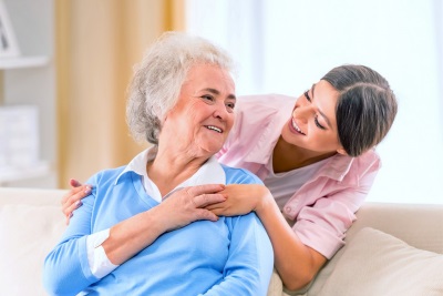 female caregiver and senior woman looking at each other